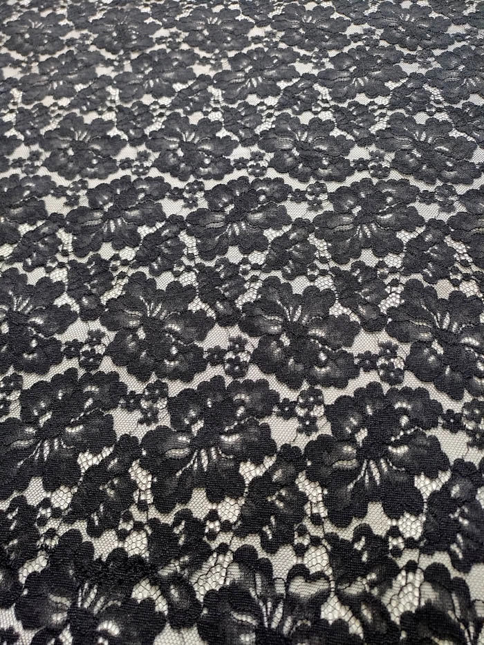 Close up of black floral knitted lace fabric